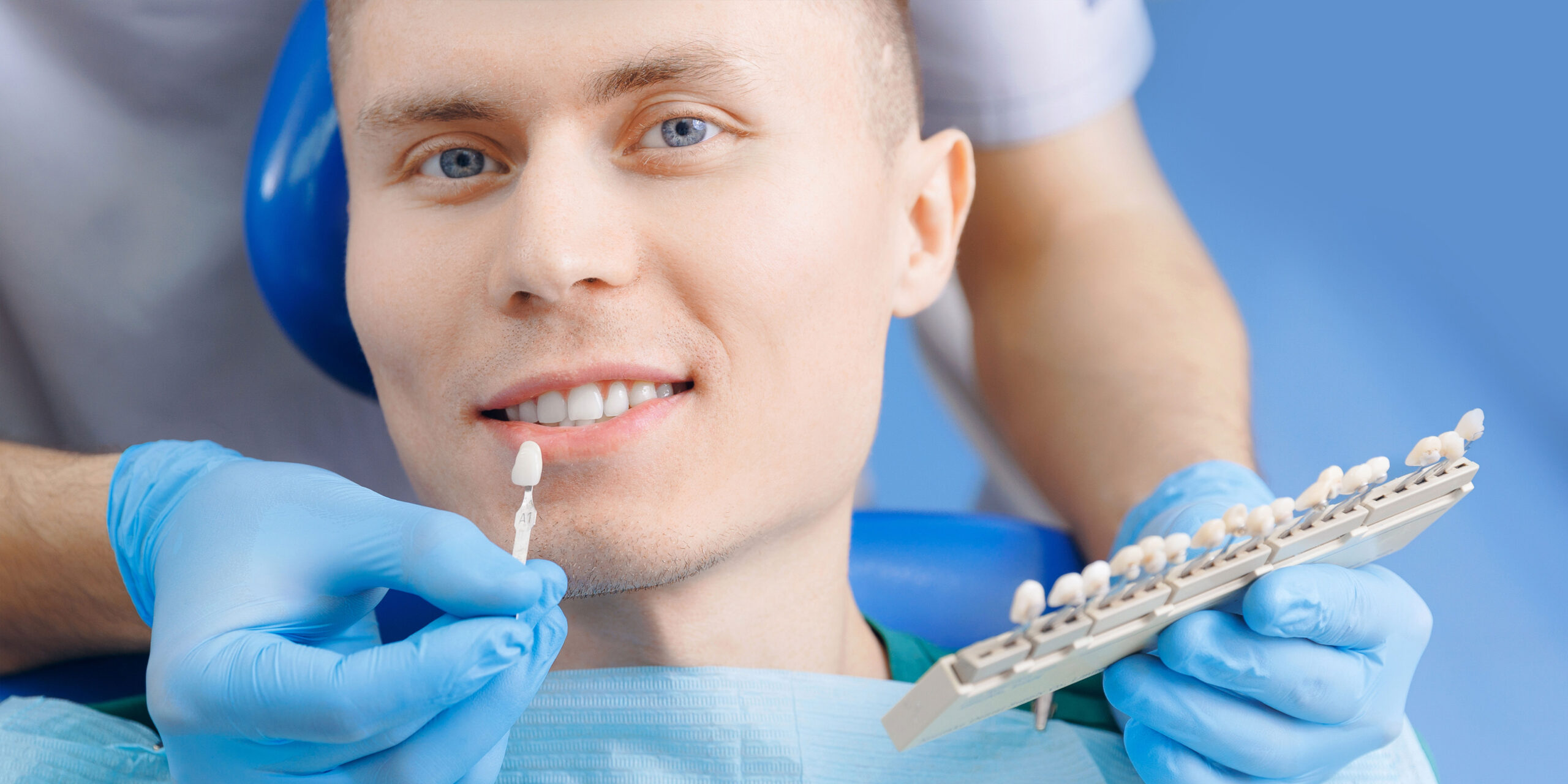 Young man with various shades of white teeth